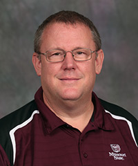Douglas E. Greiner